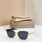 Gold-tone sunglasses with dark blue tinted lenses and thin rectangular frames