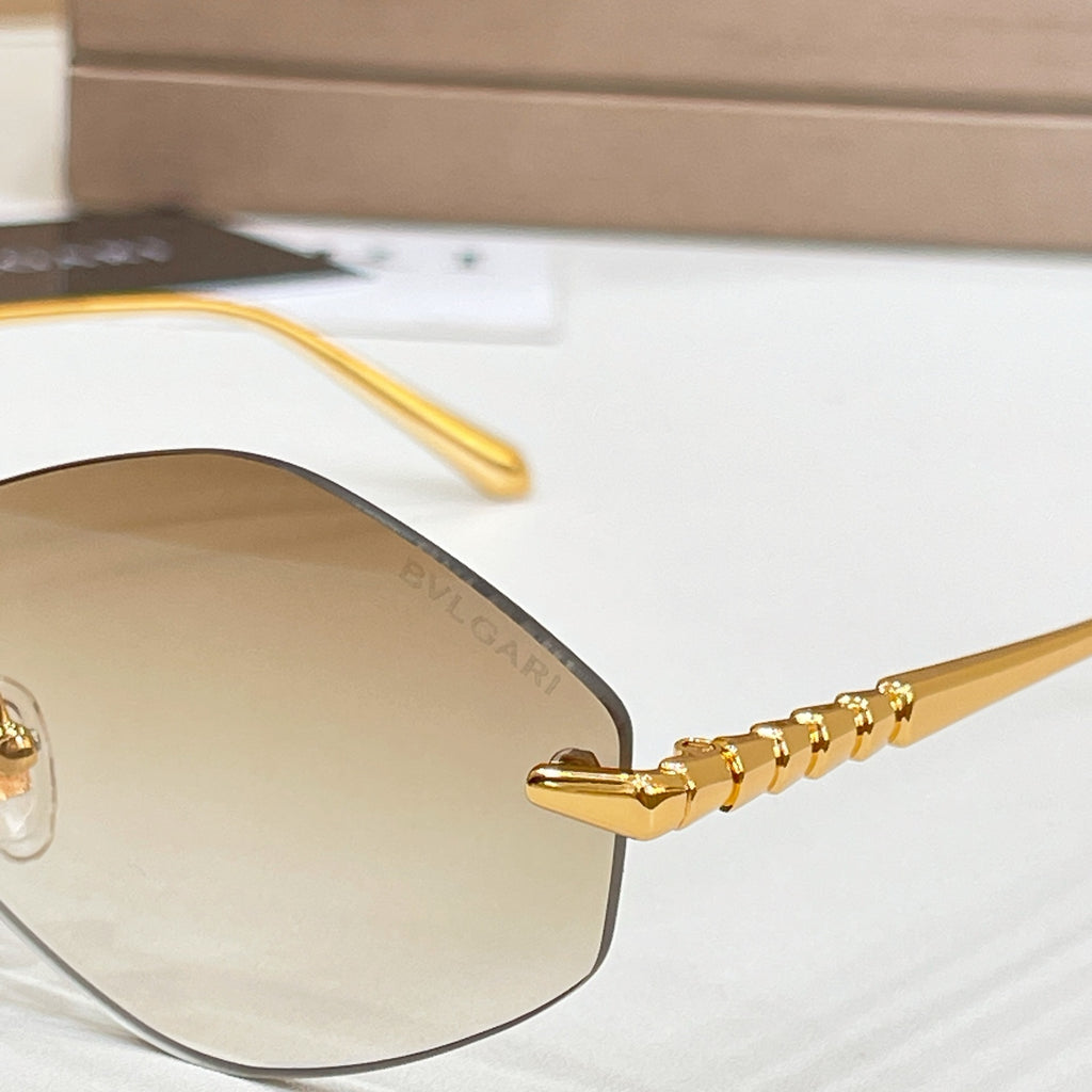 Bvlgari sunglasses close-up: gold temples with blue tinted lens