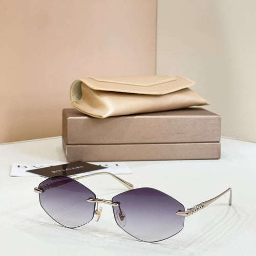 Bvlgari sunglasses with gold metal frame and purple tinted round lenses