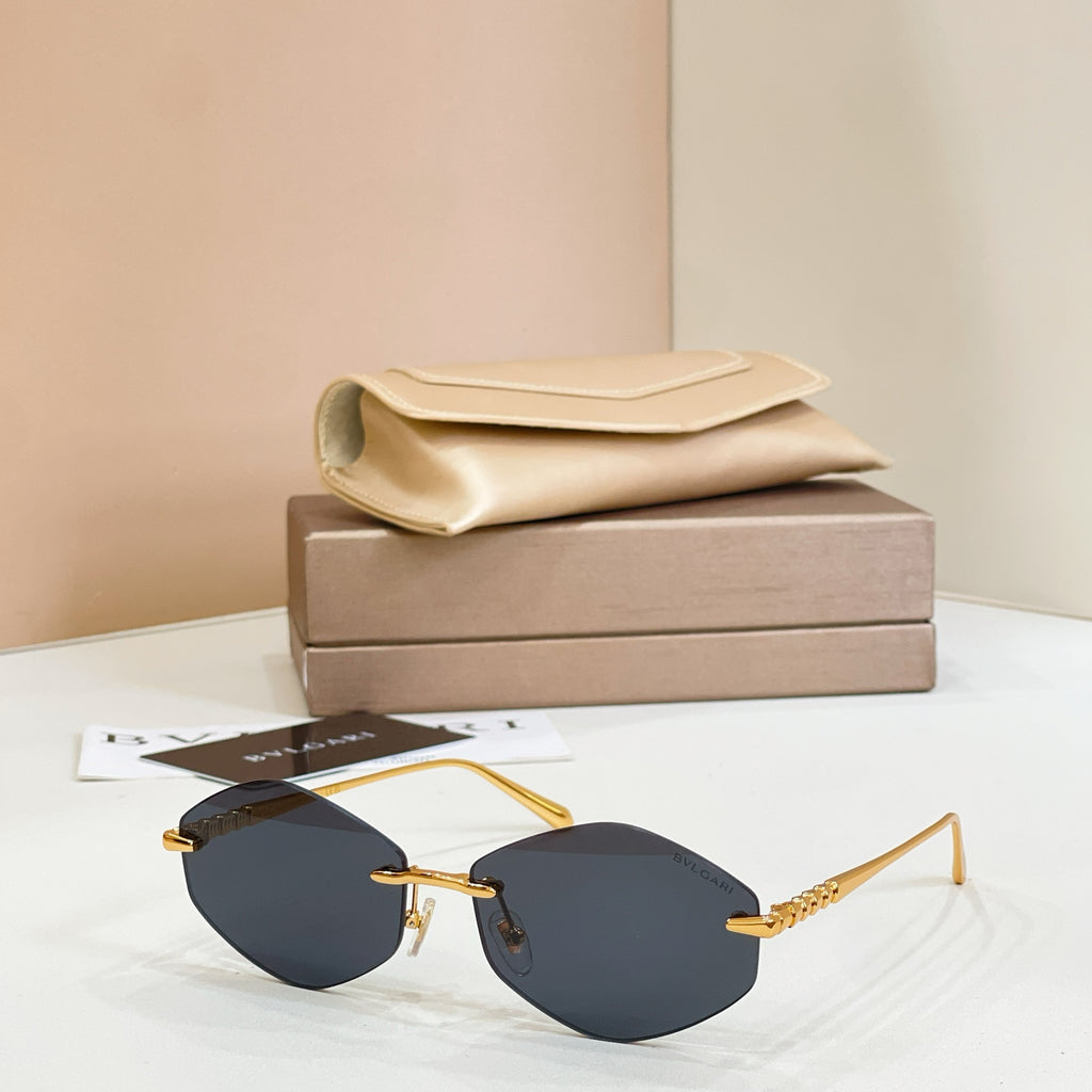Bvlgari sunglasses with gold metal frame and dark tinted round lenses
