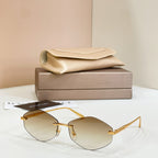 Bvlgari sunglasses with gold metal frame and amber tinted round lenses