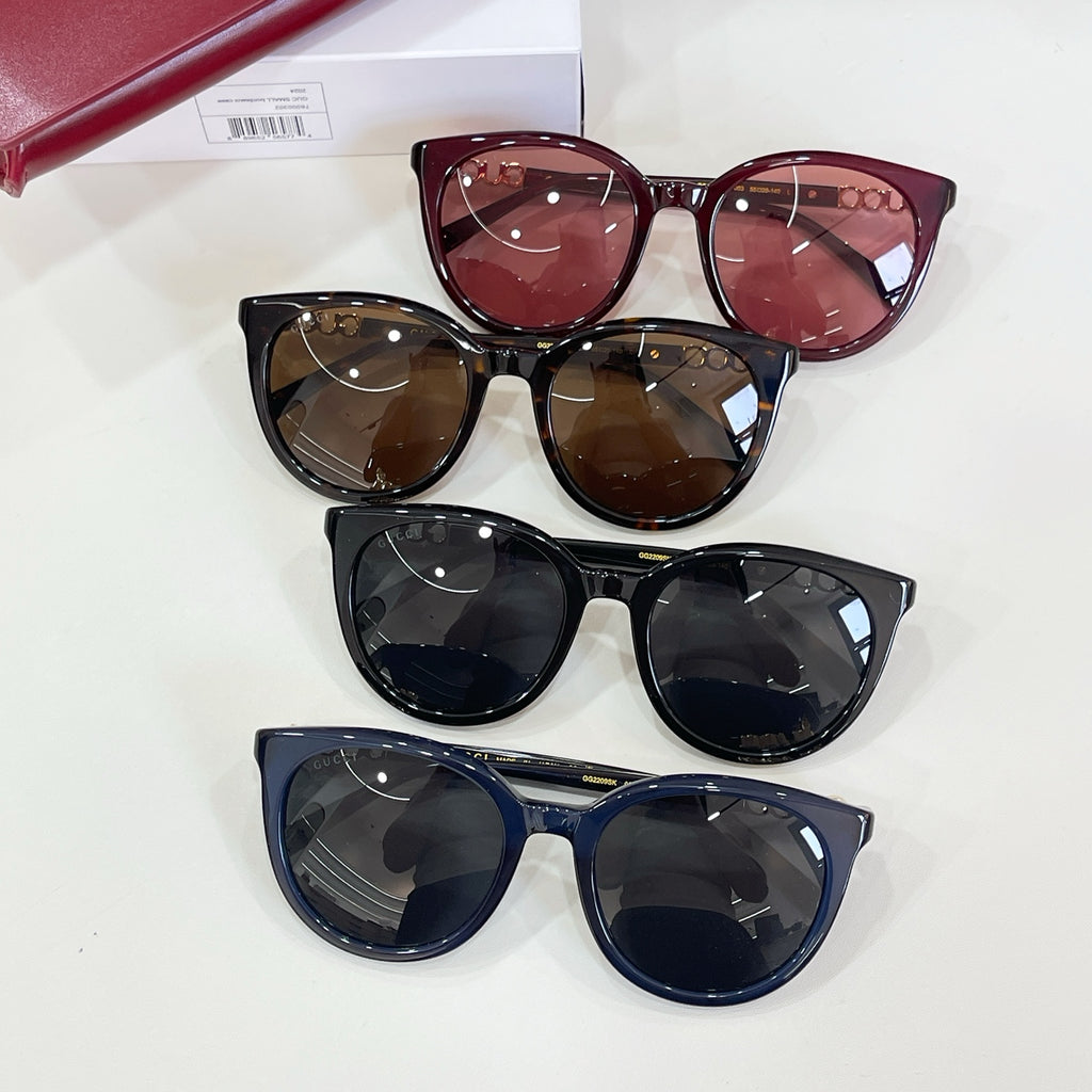 Gucci sunglasses with burgundy, brown, and black frames shown together