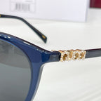 Gucci sunglasses, blue frames with gold-tone embellished temple