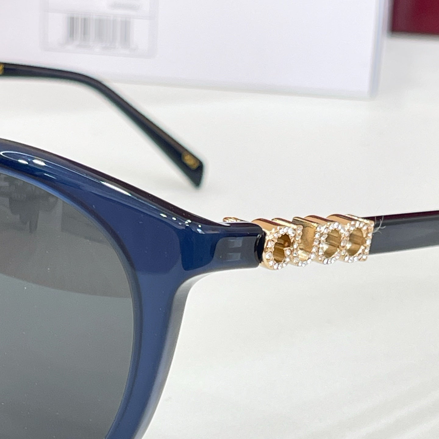 Gucci sunglasses, blue frames with gold-tone embellished temple