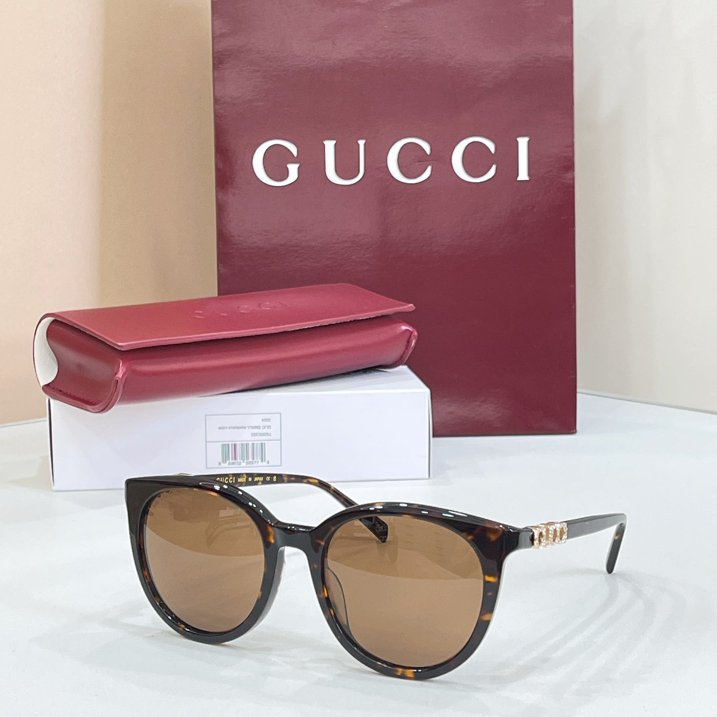 Gucci sunglasses with tortoiseshell frames and amber lenses