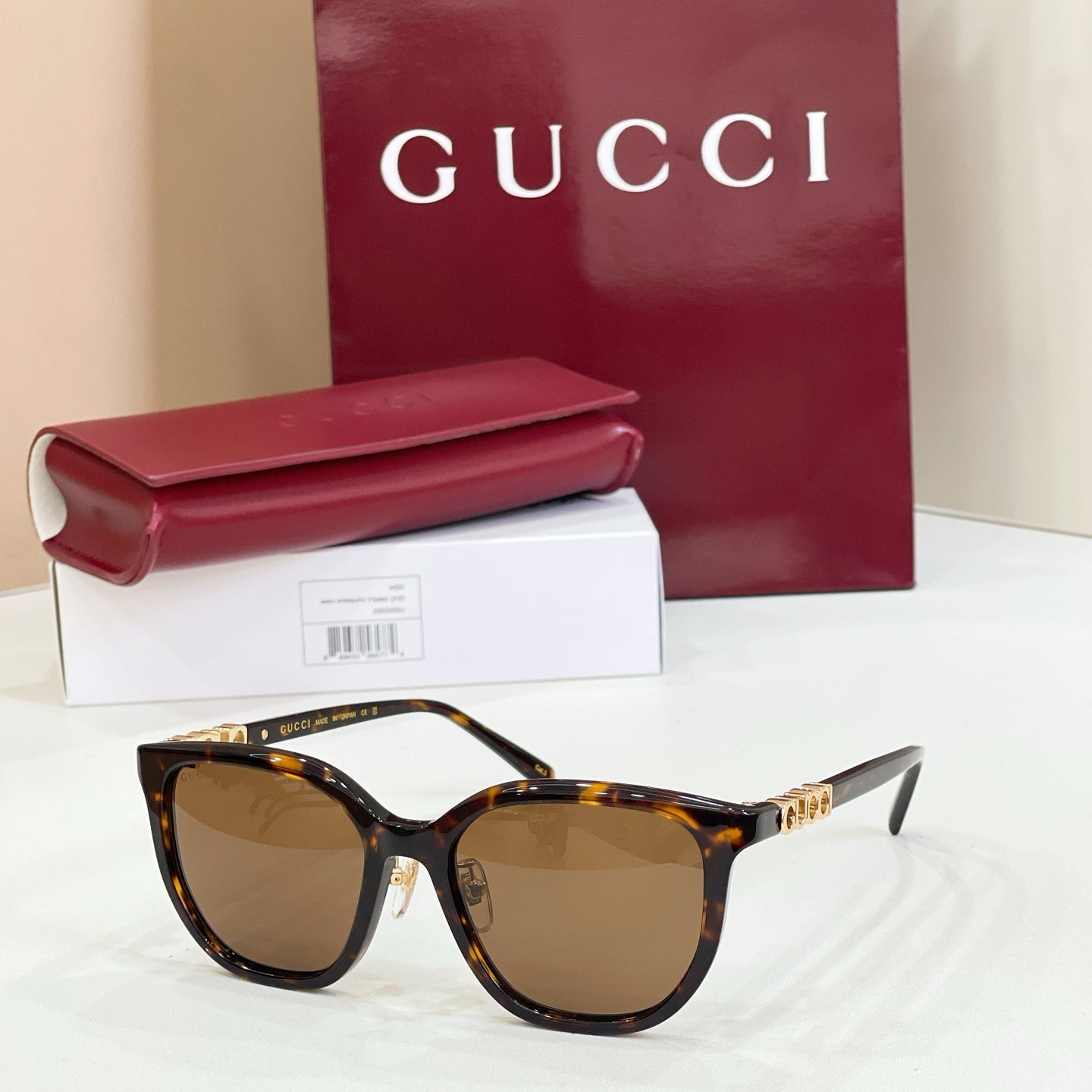 Gucci glasses with tortoiseshell frames and brown gradient lenses
