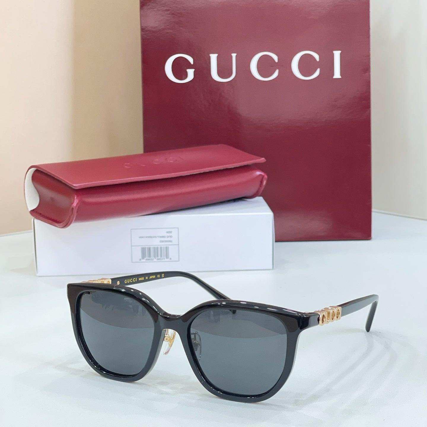 Gucci glasses with black frames and dark gray lenses