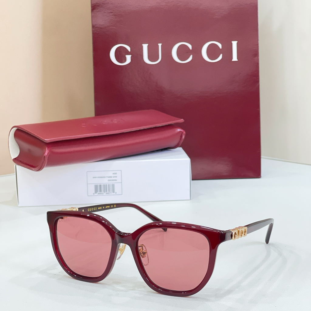 Gucci glasses with burgundy frames and pink gradient lenses