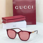 Gucci glasses with burgundy frames and pink gradient lenses
