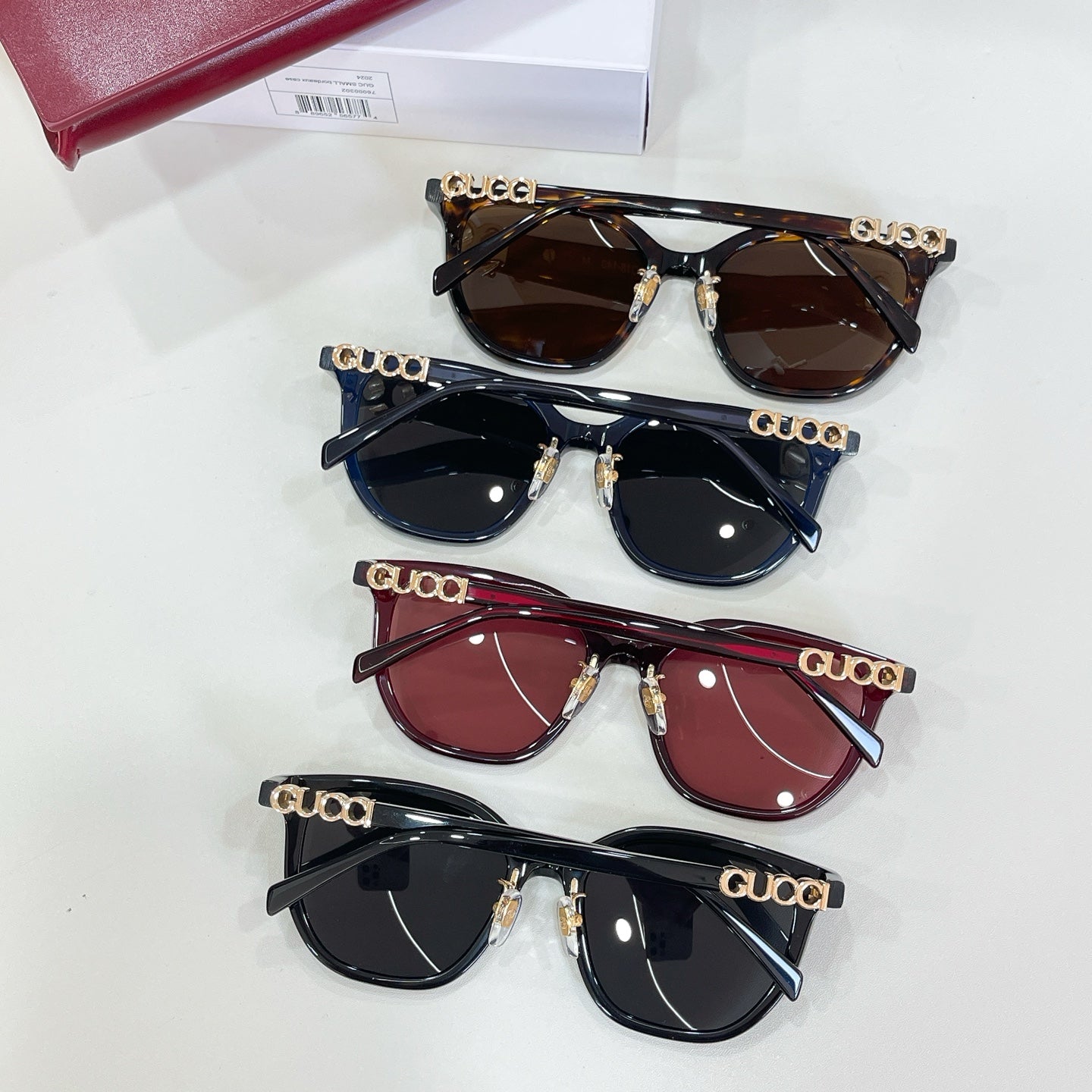 Gucci glasses set of four pairs: dark brown, black, burgundy, and navy frames