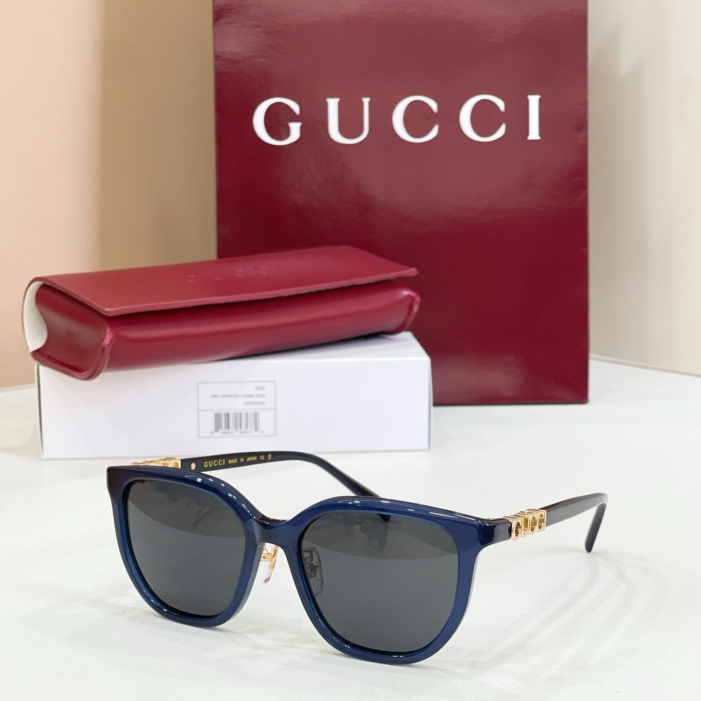 Gucci glasses with dark blue frames and dark gray lenses
