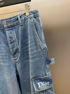 Dior pants, close-up of light blue denim cargo pocket with Dior label