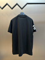 Dark navy polo shirt back with small white number 3 patch