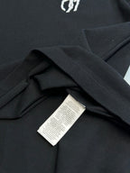Dark navy polo shirt hem with care label inside