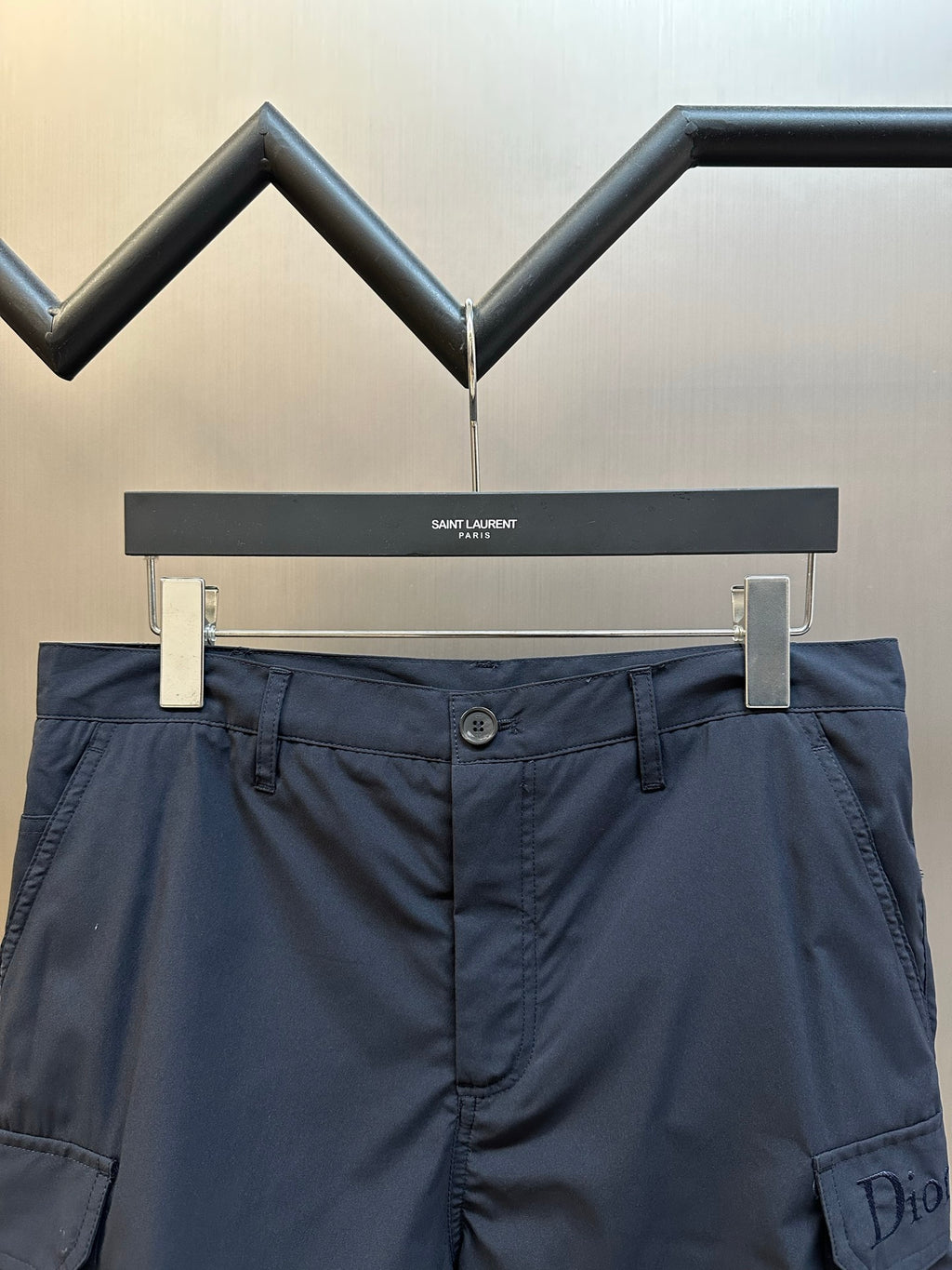 Navy cargo shorts with button waistband and side cargo pocket detail