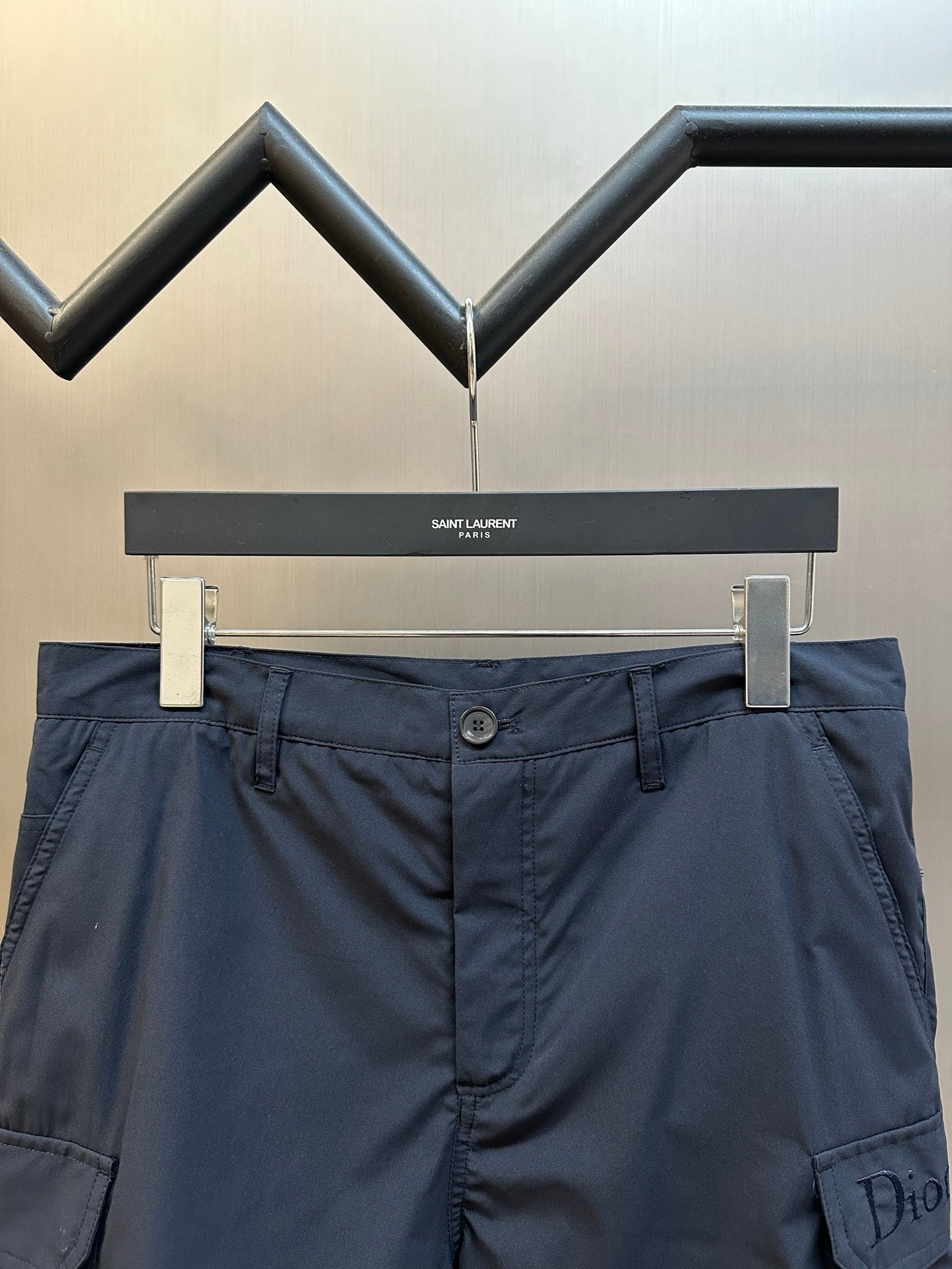 Navy cargo shorts with button waistband and side cargo pocket detail