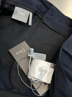 Navy cargo shorts with tags attached near waistband and buttoned fly