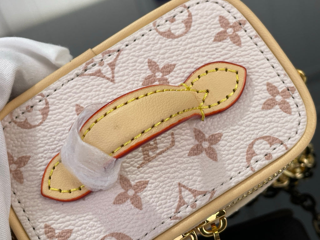 Monogram mini bag front patch with red trim and tan leather edge stitching