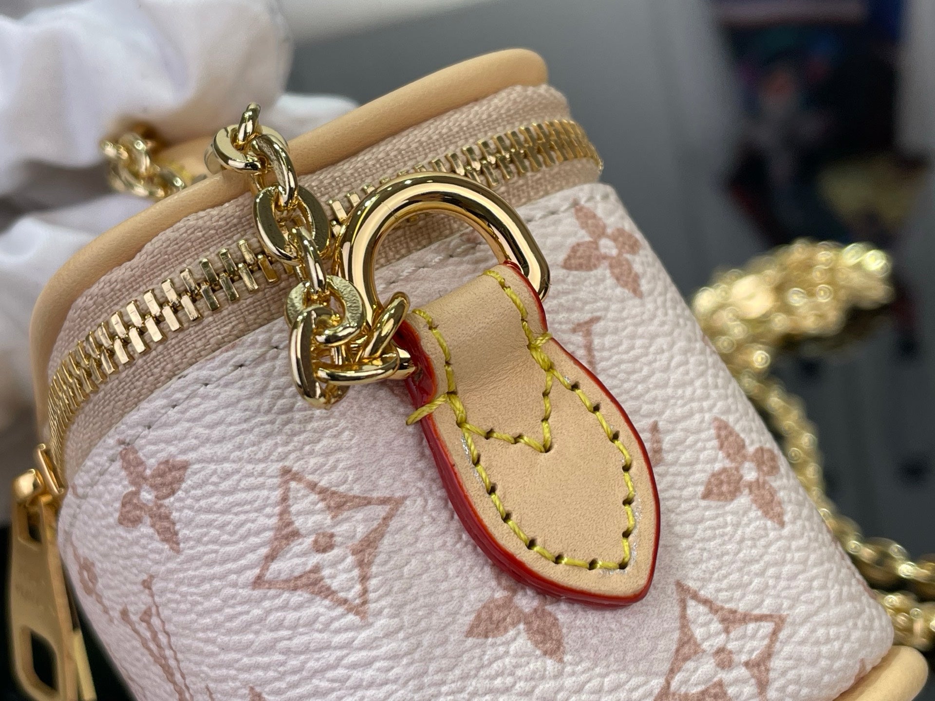 Monogram mini bag with gold ring clasp and heart-shaped leather charm