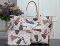 Louis Vuitton tote bag with multicolor logo print and brown leather handles