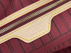 Louis Vuitton bag leather label with 'Paris' and 'Made in France' text