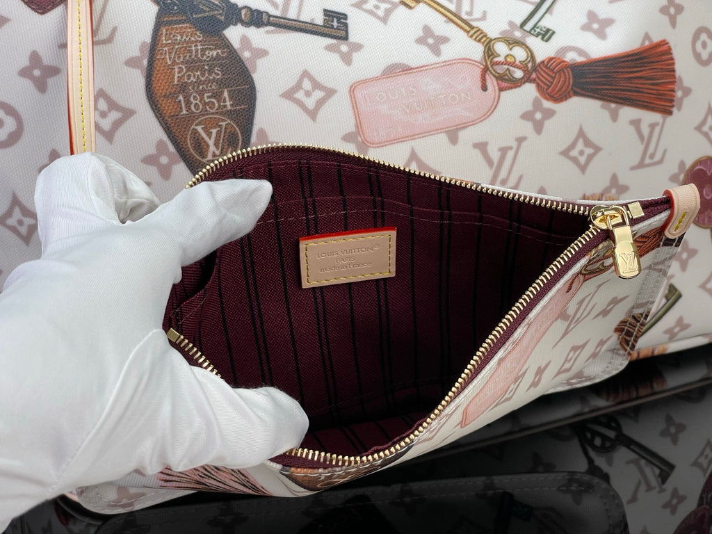 Louis Vuitton tote bag interior with red lining and zipper at the top edge