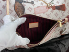 Louis Vuitton tote bag interior with red lining and zipper at the top edge