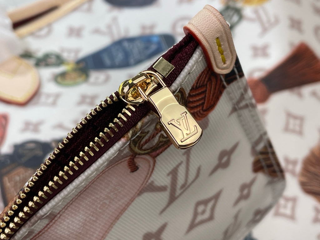 Louis Vuitton tote bag zipper area with gold-tone hardware on patterned canvas
