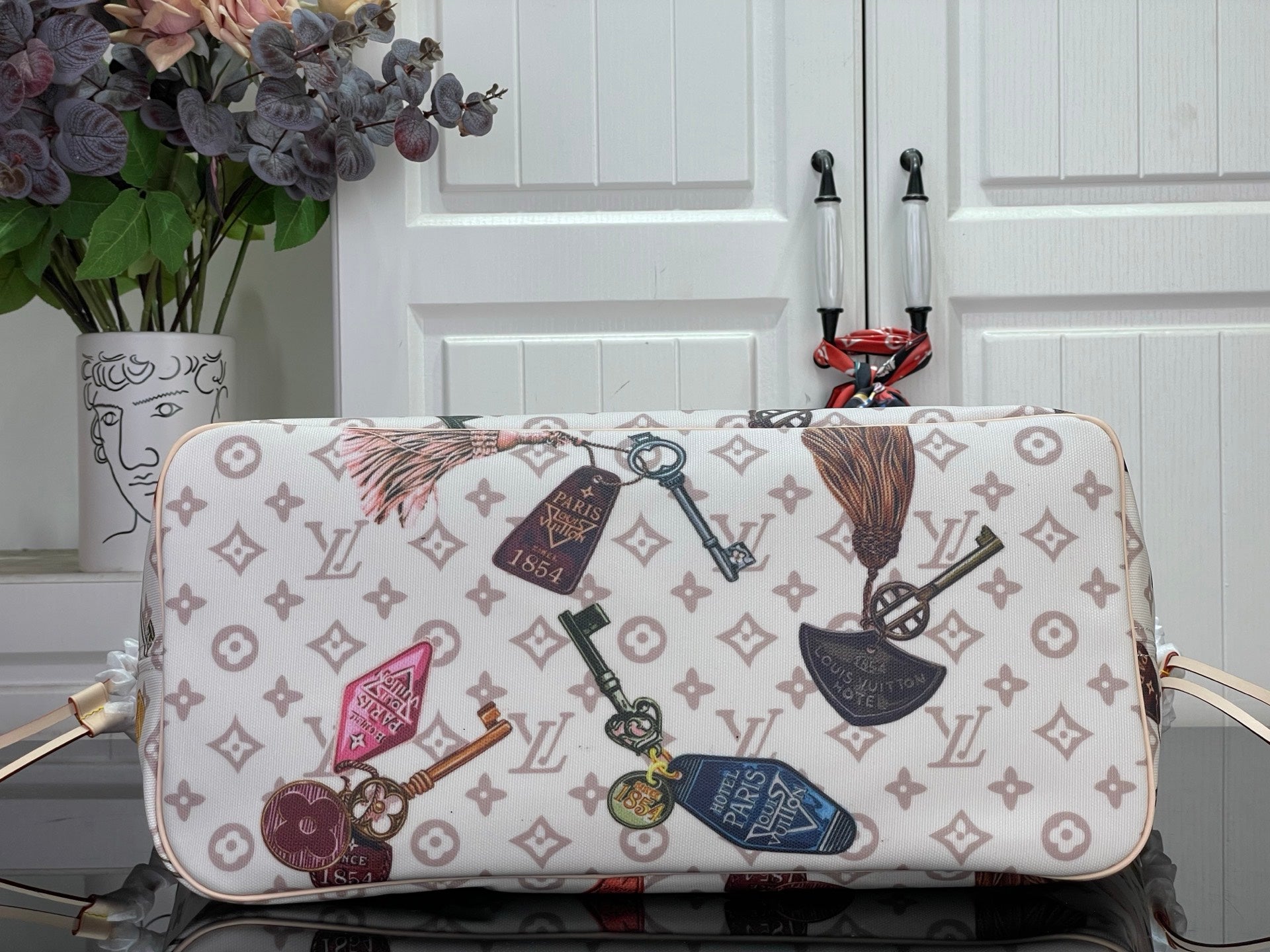 Louis Vuitton tote bag with top flap and multicolor monogram pattern