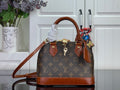 Louis Vuitton monogram tote bag with brown leather trim and top handles