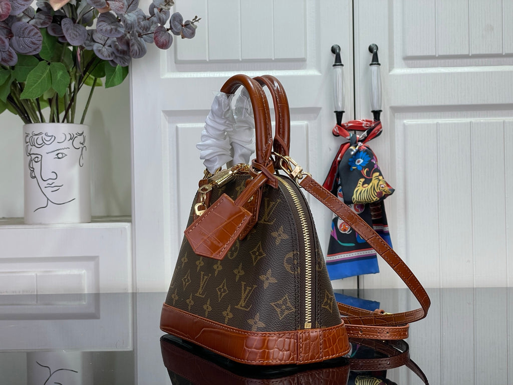 Louis Vuitton monogram bucket bag with brown leather drawstring and strap