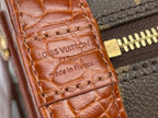 Louis Vuitton brown leather tab with embossed logo and Made in France text