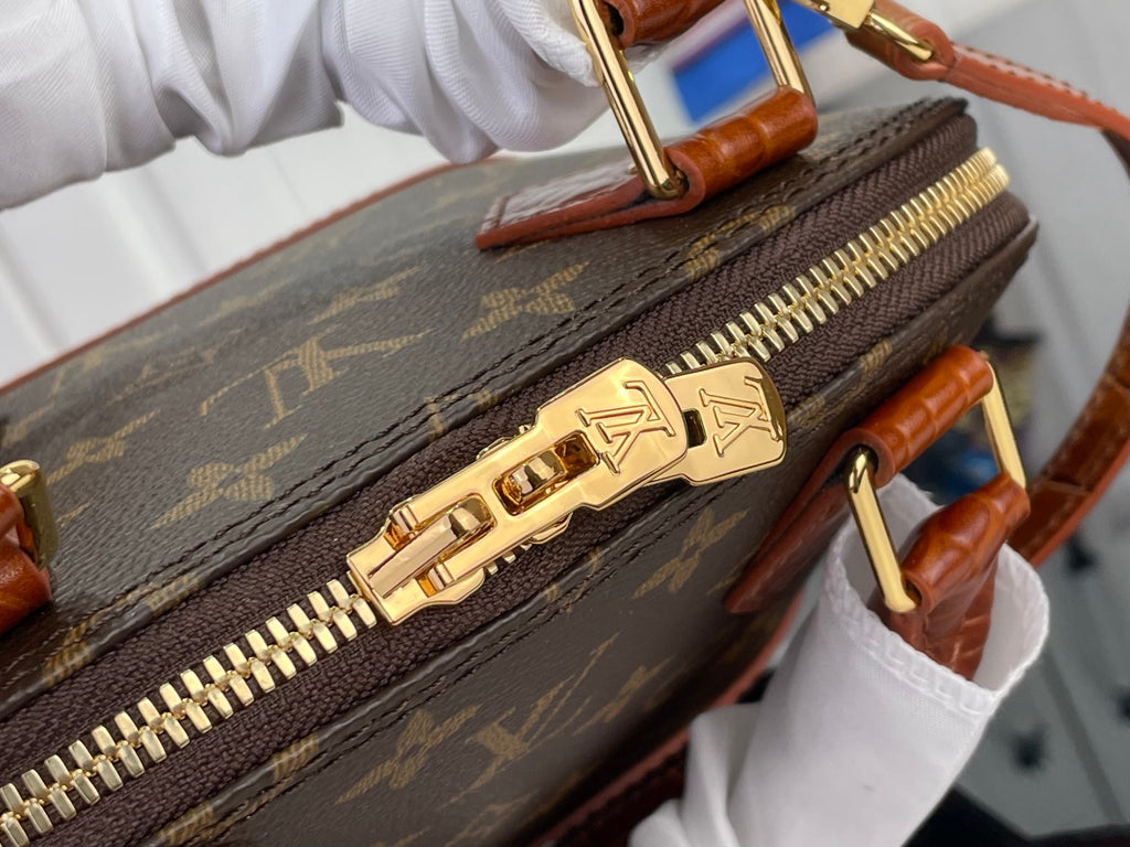 Louis Vuitton monogram pouch with gold zipper track and gold logo pull
