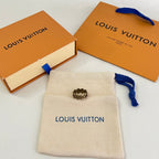 Beige jewelry pouch with blue drawstring, Louis Vuitton logo, two stud earrings