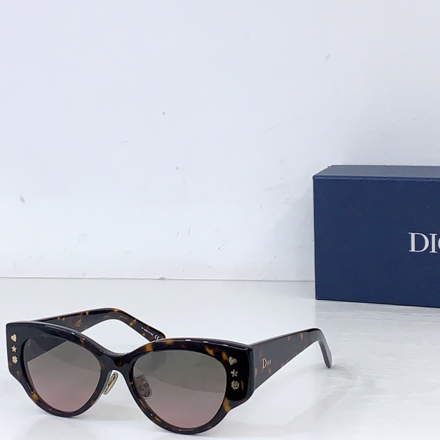 Dior cat-eye sunglasses with tortoiseshell frames and brown tint lenses