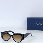 Dior cat-eye sunglasses with black frames and beige tint lenses