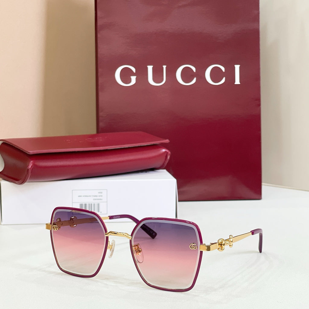 Gucci square sunglasses with burgundy frame, pink gradient lenses, and gold-tone temples.