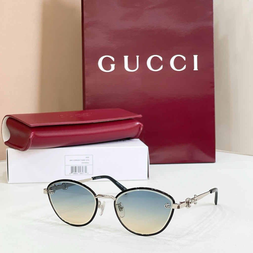 Gucci round sunglasses with dark mirrored lenses, silver-tone frame, gold accents