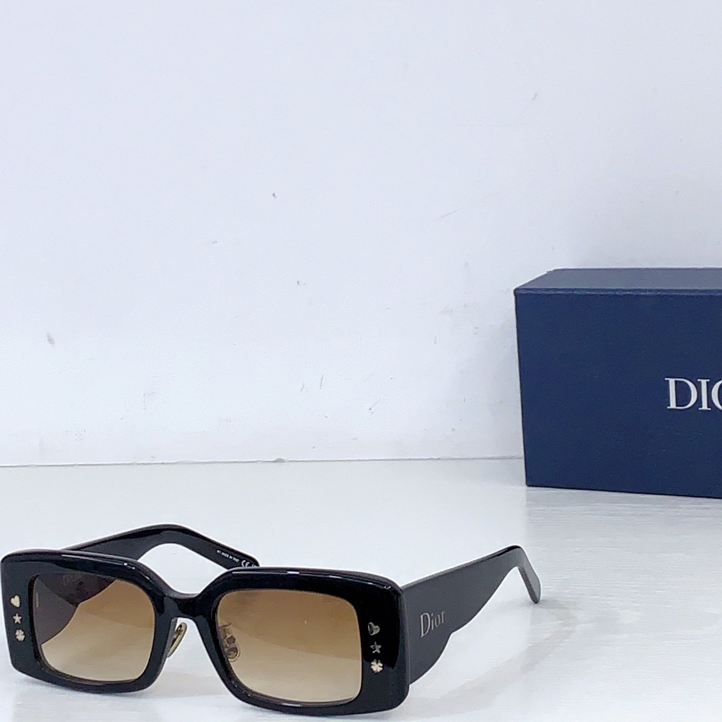 Dior square sunglasses with tortoiseshell frame and light amber lenses