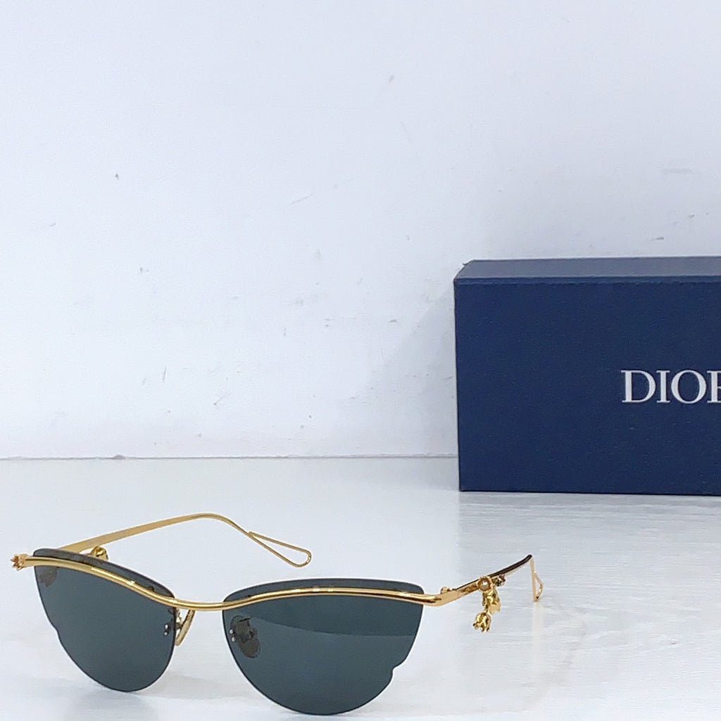 Dior sunglasses with gold-tone frame and dark gray tinted lenses