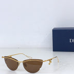 Dior sunglasses with gold-tone frame and brown tinted lenses