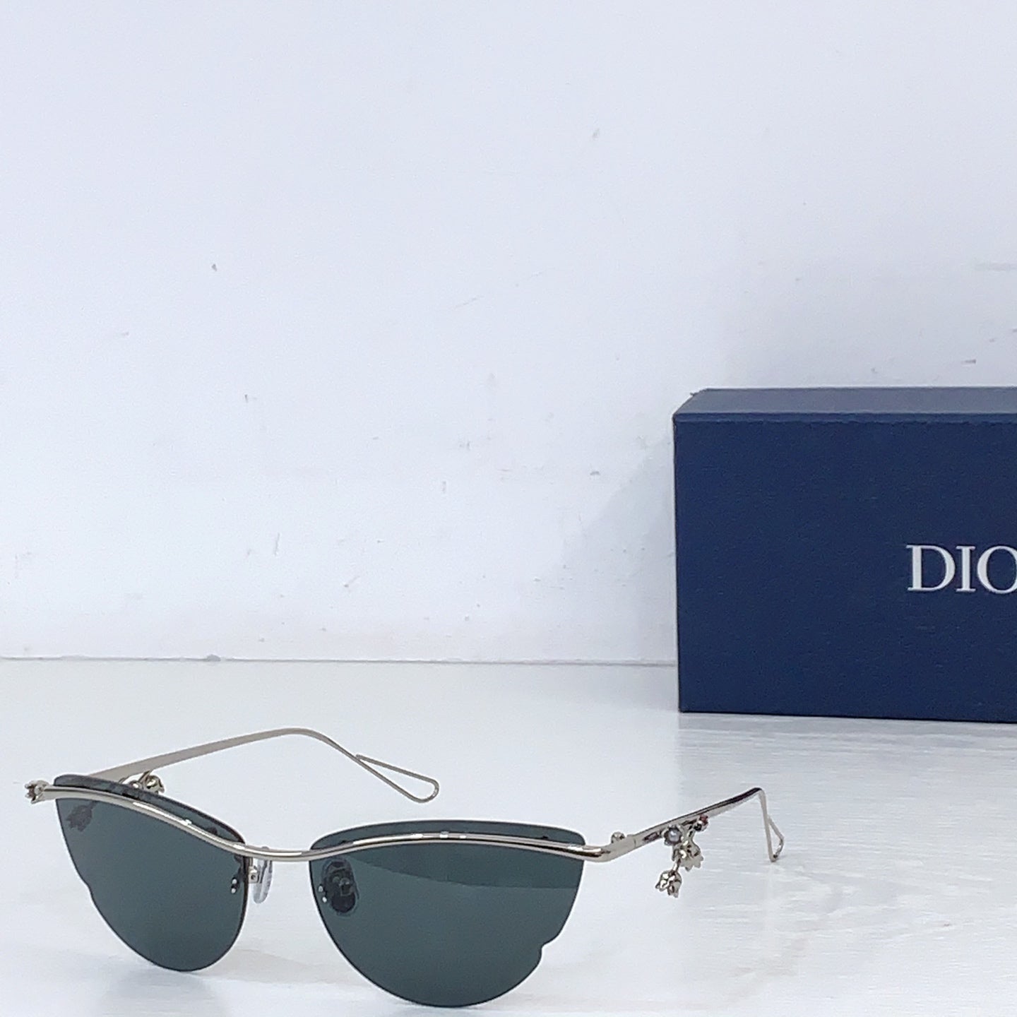 Dior sunglasses with silver-tone frame and dark lenses