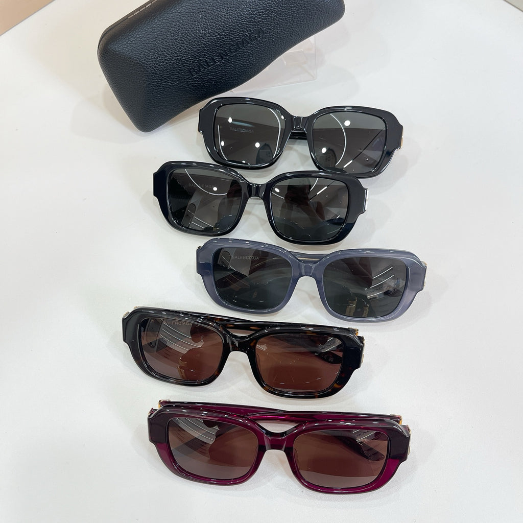 Set of four square sunglasses in assorted colors with navy case for storage