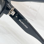 Sunglasses temple with BALENCIAGA text and metal hinge detail