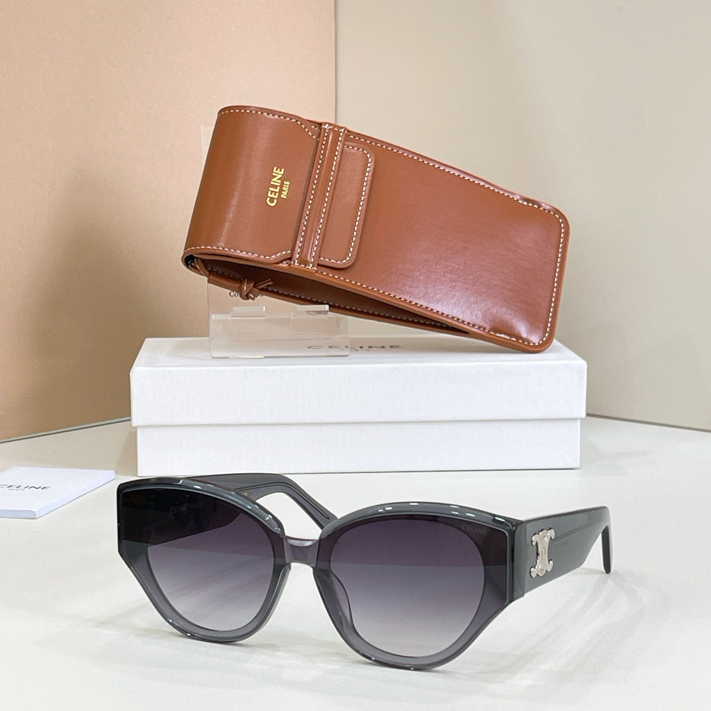 Cat-eye dark gray sunglasses with gold Celine logo and dark tinted lenses