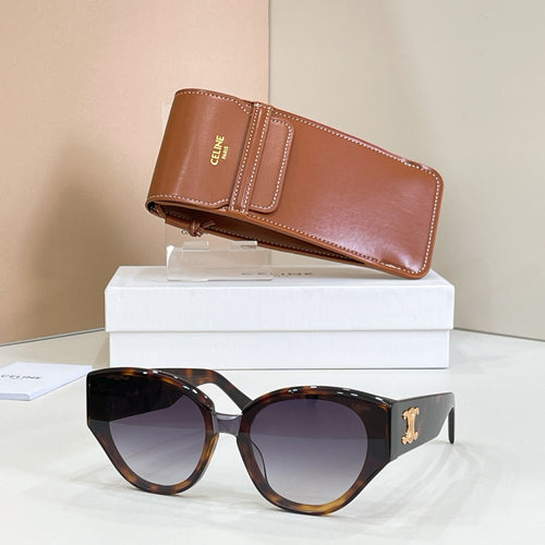 Cat-eye tortoiseshell sunglasses with gold Celine logo and dark tinted lenses