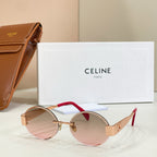 Gold-tone round sunglasses with rose-tinted lenses and red temple accents