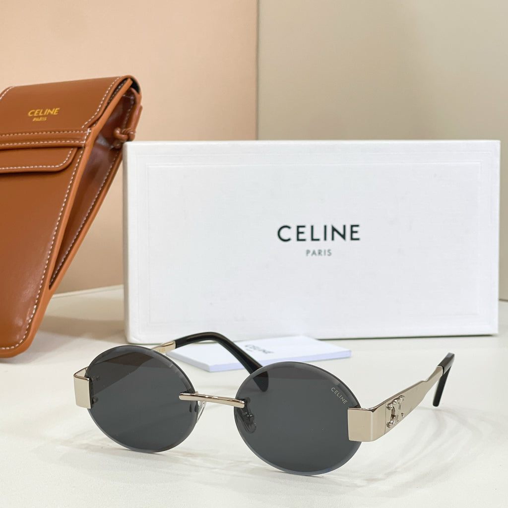 Gold-tone round sunglasses with black lenses and dark temple arms