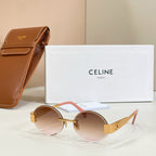Gold-tone round sunglasses with brown lenses and pink temple accents