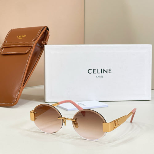Gold-tone round sunglasses with brown lenses and pink temple accents